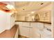 Basement bar with sink and wood countertop at 597 Oakland Ct, Aurora, CO 80010