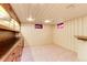 Finished basement with wood cabinetry and shelving at 597 Oakland Ct, Aurora, CO 80010