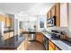 Spacious kitchen with stainless steel appliances, granite countertops, and an open layout at 10565 Wildhurst Cir, Highlands Ranch, CO 80126