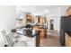 Bright and airy kitchen with an island, stainless steel appliances, and tile flooring at 10565 Wildhurst Cir, Highlands Ranch, CO 80126