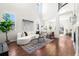Spacious living room featuring hardwood floors, high ceilings, and lots of natural light at 10565 Wildhurst Cir, Highlands Ranch, CO 80126