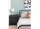 Close-up of a nicely decorated main bedroom with a black metal bed frame at 10565 Wildhurst Cir, Highlands Ranch, CO 80126