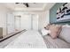 Main bedroom with two doorways and a black metal bed at 10565 Wildhurst Cir, Highlands Ranch, CO 80126