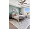 Comfortable main bedroom featuring a tray ceiling and nice decor at 10565 Wildhurst Cir, Highlands Ranch, CO 80126