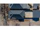 Overhead view of a home with a dark gray roof, surrounded by a fenced backyard and neighboring houses at 4059 Quivas St, Denver, CO 80211