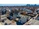 An elevated view displays a home and its neighborhood with the Denver skyline visible in the distance at 4059 Quivas St, Denver, CO 80211