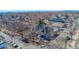 An aerial view showing the house among neighborhood trees and the city in the distance at 4059 Quivas St, Denver, CO 80211