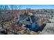 Aerial view of a residential neighborhood with tree-lined streets and well-maintained single-Gathering homes at 4059 Quivas St, Denver, CO 80211