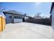 A spacious backyard boasting a sizable concrete patio, perfect for outdoor entertainment and activities at 4059 Quivas St, Denver, CO 80211