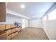 Finished basement offers versatile space, neutral carpeting, and potential for various uses at 4059 Quivas St, Denver, CO 80211