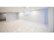 Large basement space showcasing tiled floors, a utility area, and customizable open layout at 4059 Quivas St, Denver, CO 80211