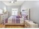 Charming bedroom with hardwood floors, ample storage, and calming neutral color scheme at 4059 Quivas St, Denver, CO 80211