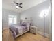 Comfortable bedroom with stylish décor, wood flooring, and a ceiling fan at 4059 Quivas St, Denver, CO 80211