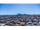A sprawling cityscape reveals numerous residences with the Denver skyline in the distance at 4059 Quivas St, Denver, CO 80211
