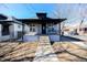 Charming single-Gathering home featuring a covered porch, well-maintained yard, and classic architectural details at 4059 Quivas St, Denver, CO 80211