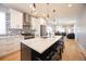 Spacious kitchen with island, stainless steel appliances, granite countertops, and an open floor plan at 4059 Quivas St, Denver, CO 80211