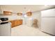 Basement laundry area equipped with appliances, storage cabinets, and ample counter space at 4059 Quivas St, Denver, CO 80211