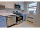 Well-equipped kitchen with stainless steel appliances, new countertops, and updated fixtures at 2100 N Franklin St # 8, Denver, CO 80205