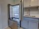 Bright kitchen featuring stainless steel appliances and a modern refrigerator with plenty of storage space at 2100 N Franklin St # 8, Denver, CO 80205