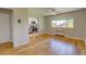 Bright living room featuring hardwood floors, ceiling fan, and an open kitchen area at 2100 N Franklin St # 8, Denver, CO 80205