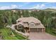 A beautiful, landscaped home featuring a three car garage and a stone walkway at 1456 Shavano Ct, Evergreen, CO 80439