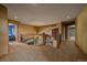 Spacious second story hallway with wood railing and natural light from the staircase windows below at 1456 Shavano Ct, Evergreen, CO 80439
