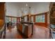 Spacious kitchen island offering a sink, modern dishwasher, lots of storage and outdoor views at 1456 Shavano Ct, Evergreen, CO 80439
