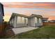 Exterior of home featuring a walk-out patio and a fully fenced yard at 5928 N Odessa St, Aurora, CO 80019