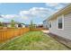 Green backyard with a wood fence for privacy; a perfect outdoor space at 5928 N Odessa St, Aurora, CO 80019
