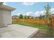 A spacious backyard has a wooden fence and patio at 5928 N Odessa St, Aurora, CO 80019