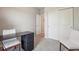 A simple bedroom includes a closet and an adjacent doorway at 5928 N Odessa St, Aurora, CO 80019