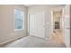 Bedroom featuring a window, closet, and an adjacent doorway at 5928 N Odessa St, Aurora, CO 80019
