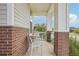 Cozy front porch offers a relaxing outdoor space with seating and a view of the neighborhood at 5928 N Odessa St, Aurora, CO 80019