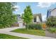 Charming home with a well-manicured front yard, lush greenery, and a cozy front porch at 5928 N Odessa St, Aurora, CO 80019