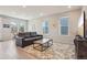 Bright living room with hardwood floors, modern furnishings, and ample natural light at 5928 N Odessa St, Aurora, CO 80019