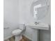 Clean half bathroom with a pedestal sink and neutral paint at 3334 N Catawba Way, Aurora, CO 80019