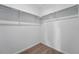 Walk-in closet with shelving, neutral carpeting, and white walls at 3334 N Catawba Way, Aurora, CO 80019