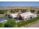 Aerial view of the Aurora Highlands community center and clubhouse featuring solar panels and lush landscaping at 3334 N Catawba Way, Aurora, CO 80019