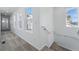 Bright hallway with a carpet, natural light, and white walls at 3334 N Catawba Way, Aurora, CO 80019