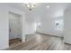 Open living room with wood floors, bright natural light, and neutral paint at 3334 N Catawba Way, Aurora, CO 80019