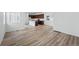 Open living room with wood floors leading to the kitchen at 3334 N Catawba Way, Aurora, CO 80019