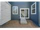 Back patio with siding and sliding glass door to backyard at 3334 N Catawba Way, Aurora, CO 80019