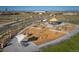 Aerial view of a colorful community playground featuring slides, a carousel, and shaded picnic areas at 3334 N Catawba Way, Aurora, CO 80019