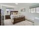 Comfortable bedroom with a wooden bed frame, neutral bedding, two windows, and wooden nightstand, creating a cozy atmosphere at 352 S Lafayette St # 204, Denver, CO 80209