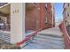 Exterior of building with staircase, small balcony and brick facade at 352 S Lafayette St # 204, Denver, CO 80209