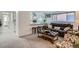Inviting living room with leather sofa, ottoman, and bar seating overlooking the kitchen at 352 S Lafayette St # 204, Denver, CO 80209