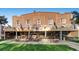 Charming restaurant with outdoor seating, brick facade, and flags at 352 S Lafayette St # 204, Denver, CO 80209