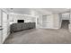 Spacious finished basement featuring plush carpeting and ample seating area at 1053 Snow Lily Ct, Castle Pines, CO 80108