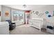 Charming Bedroom with space-themed decor, large window, and comfortable seating at 1053 Snow Lily Ct, Castle Pines, CO 80108