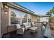 Outdoor deck area with wicker seating and grill, perfect for relaxing at 1053 Snow Lily Ct, Castle Pines, CO 80108